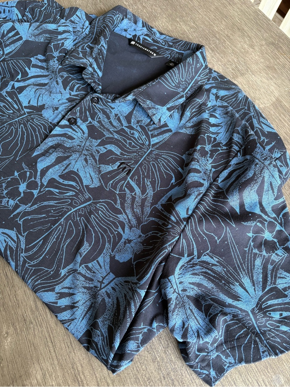 Travis Mathew Navy Polo with Blue Tropical Print